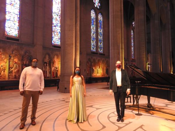 Standing inside Grace Cathedral, singers Kenneth Kellogg, Stacee Firestone, and accompanist and music director Ronny Michael Greenberg.