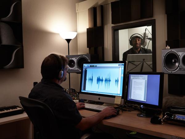 Jason directing voice talent at the Earprint Studio in San Francisco.
