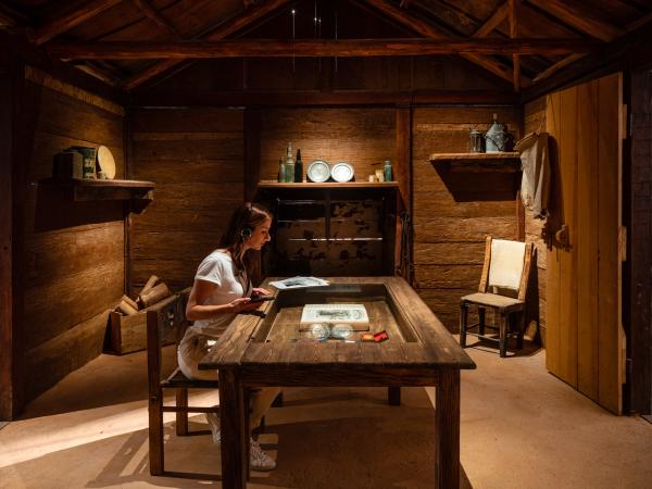 A young woman enjoys The Hugh mobile experience in one of the exhibits at the Australian Stockman's Hall of Fame.