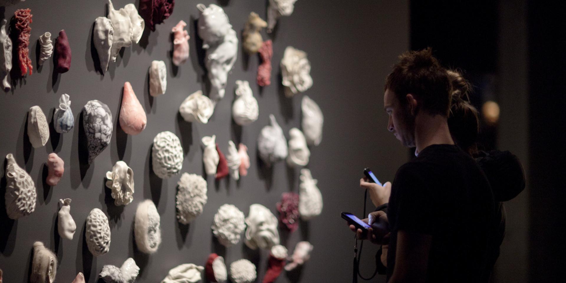 Visitors in front of exhibit at the Museum of Old and New Art