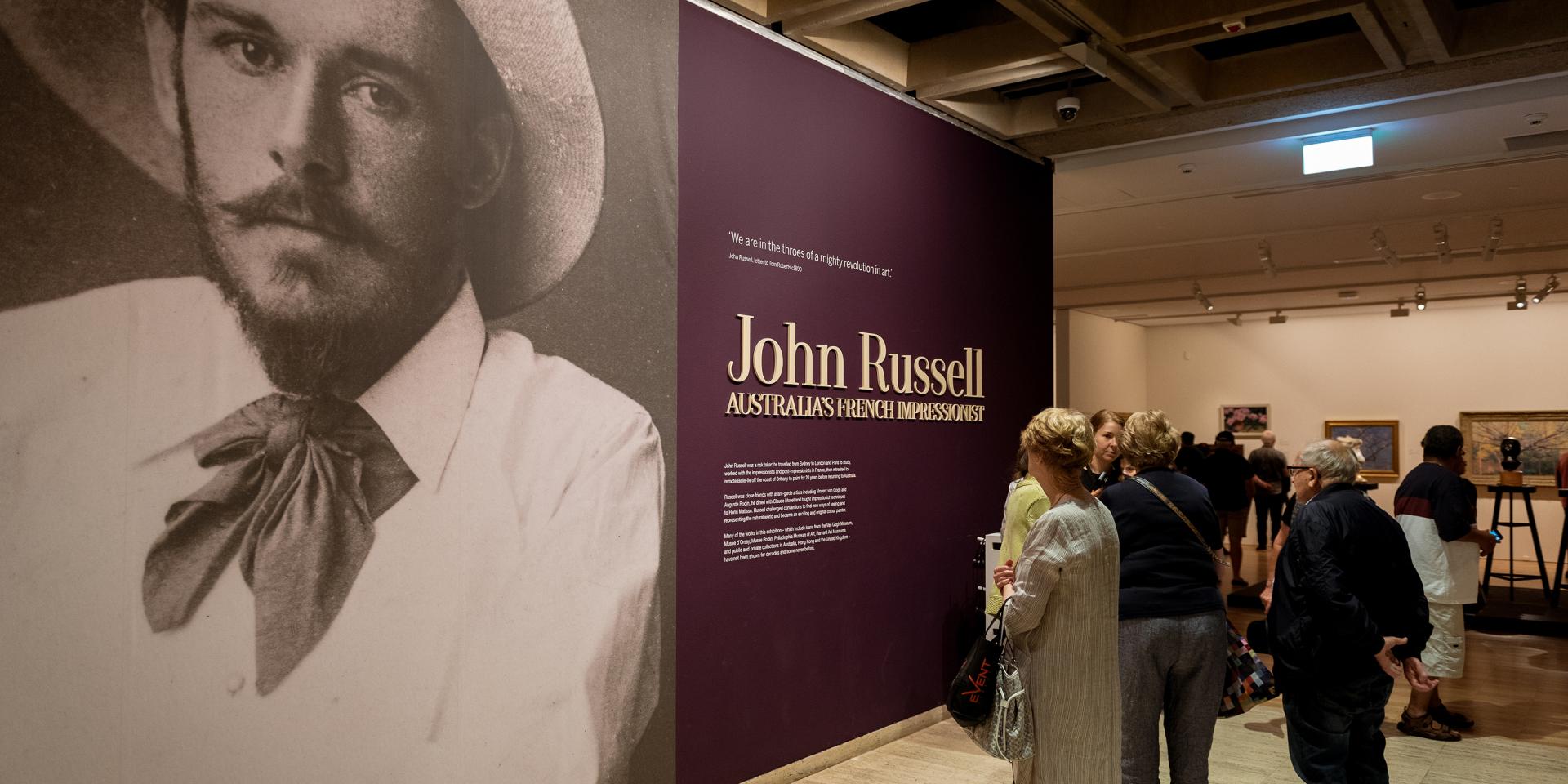 A group of people gathered at the Josh Russell exhibition at the Art Gallery of NSW