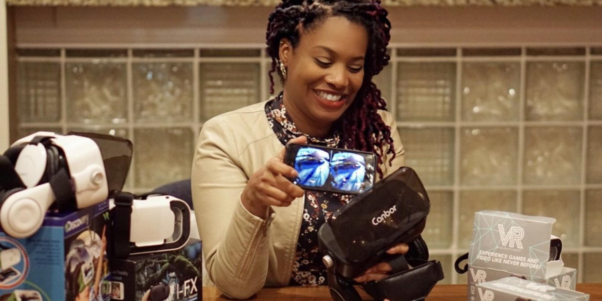 Kai with VR headsets and their boxes