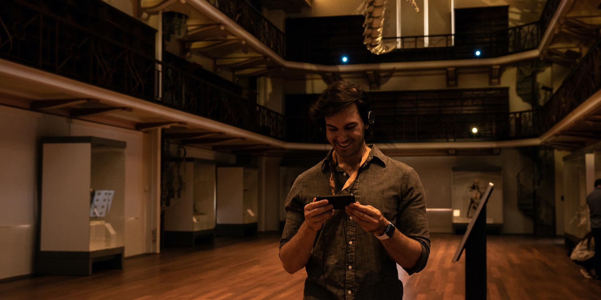 Visitor enjoying the Gogo app inside WA Museum Boola Bardip.