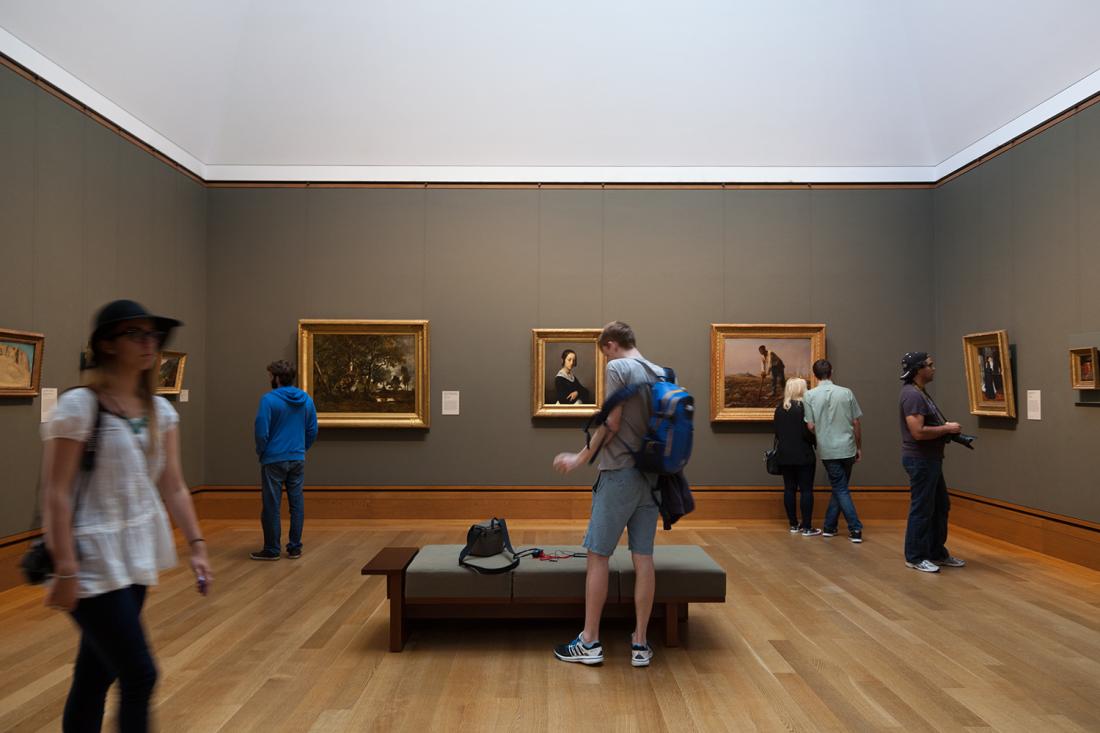 People walking around a gallery inside the J. Paul Getty Museum.